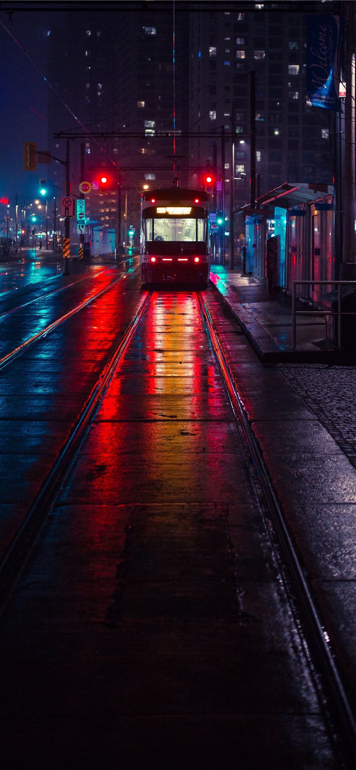 Photo Of Tram Beside Waiting Station During Nightt Iphone 13 Pro